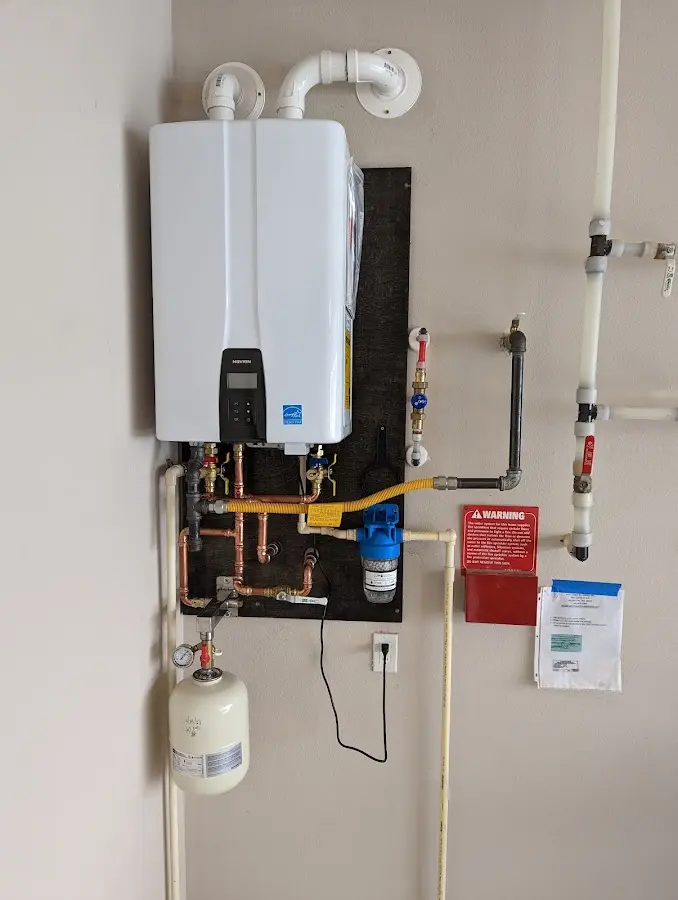 Professional plumber installing copper piping in a Taylor Mill home